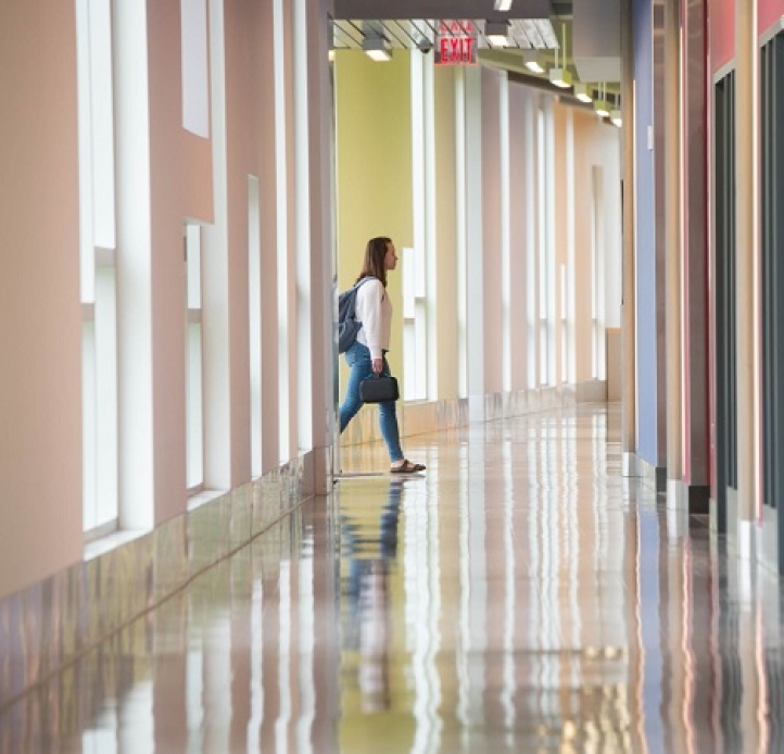 Student walking through hallway
