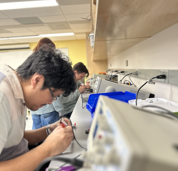 Students soldering in lab