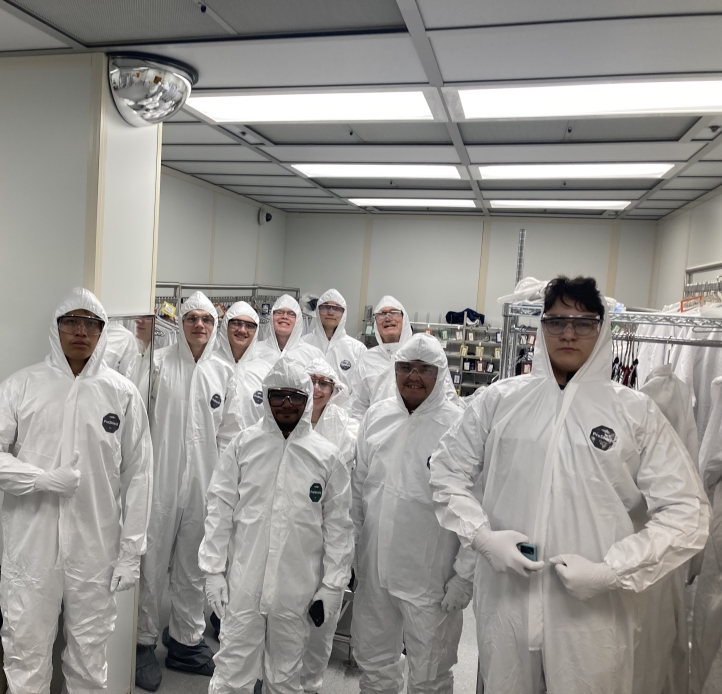 Students with hazmat suits in nanofabrication lab at Cornell