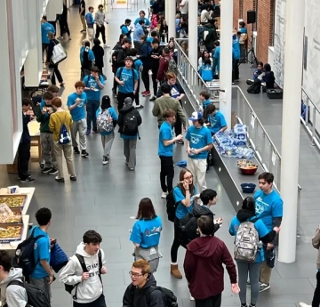 Students in the lobby of SAMC during the 2025 Physics Olympics